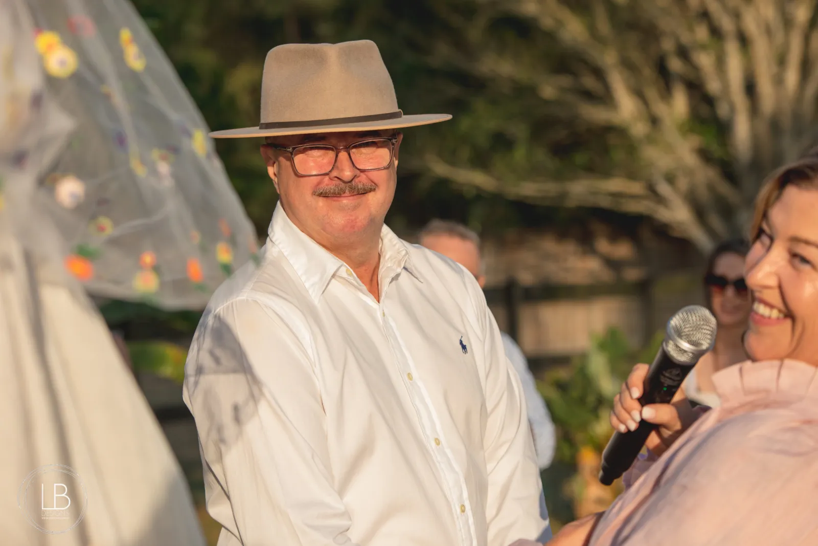 A couple renewing their vows together at an intimate ceremony